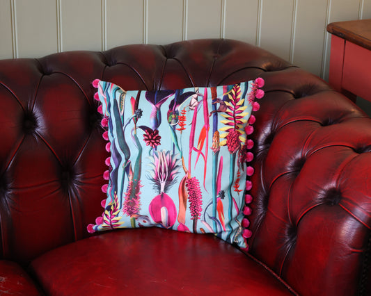 Paradise Blue Velvet Cushion With Raspberry Pompoms