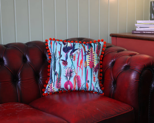 Paradise Blue Velvet Cushion With Orange Pompoms